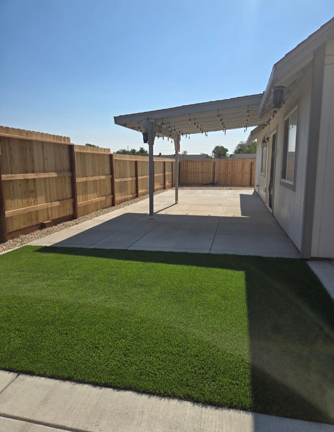Metal pergola with string lights